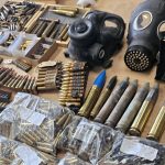 a table of bullets and gasmasks